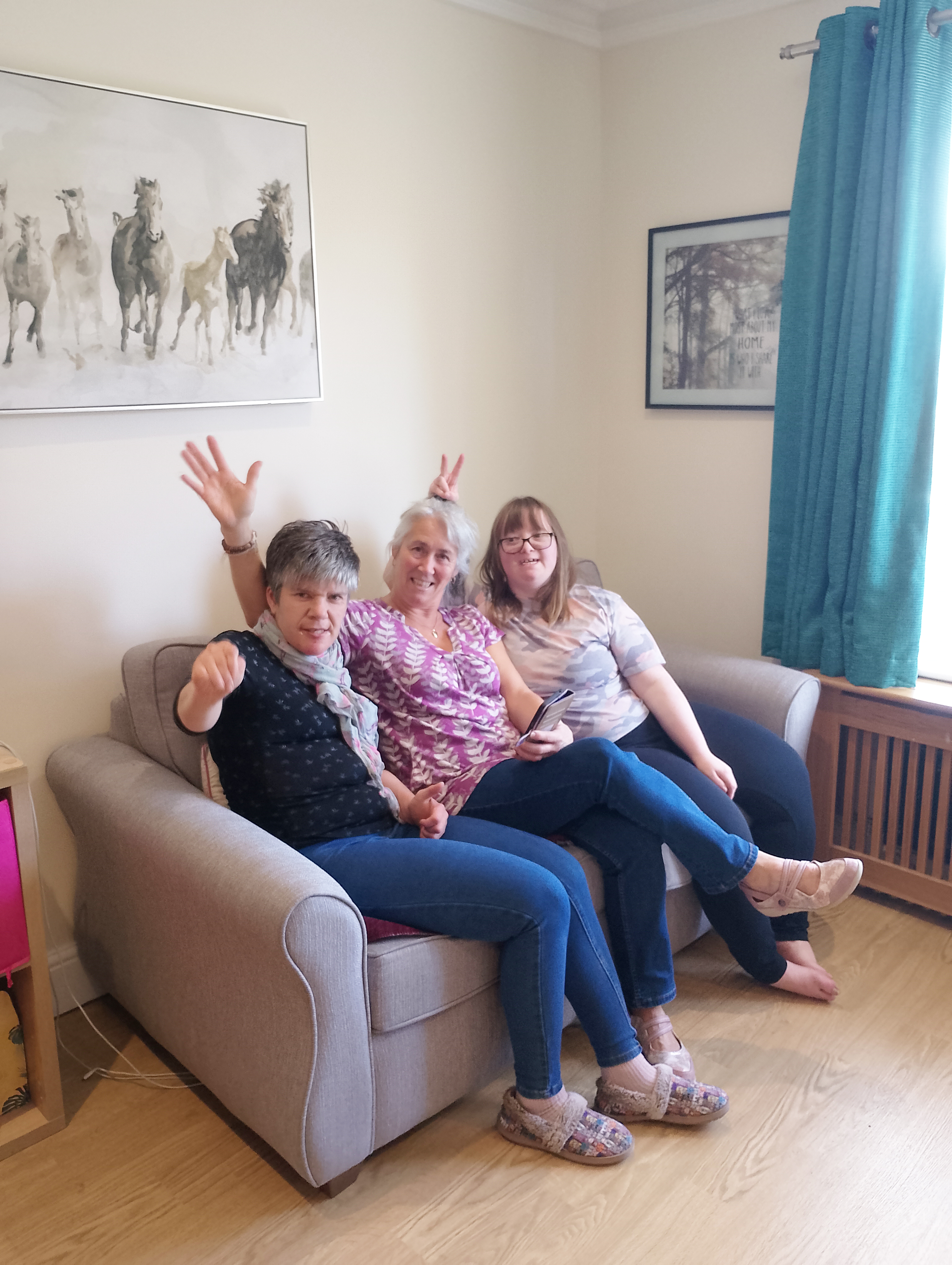 Three colleagues relaxing together on the sofa